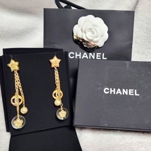 Chanel star dangle earrings